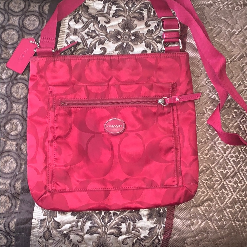 magenta Coach crossbody purse